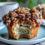 Moist banana muffins made with sourdough discard and crowned with a sweet cinnamon streusel topping.  