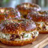 A batch of golden-brown cottage cheese protein bagels, soft and chewy, ready for a high-protein breakfast or snack.  