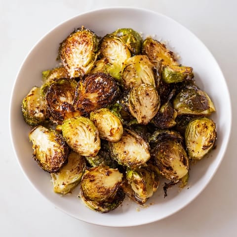 Golden, caramelized Roasted Brussels Sprouts, crispy edges and tender insides, perfect for a flavorful side.