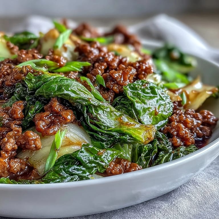 A freshly prepared Chinese Ground Beef and Cabbage Stir-Fry featuring tender beef crumbles and crunchy cabbage tossed in savory sauce.