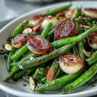 Roasted garlic green beans with caramelized garlic and lemon zest for a savory Easter side dish.  
