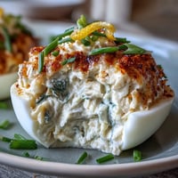 Crab Cake Deviled Eggs with Old Bay, a creamy, zesty, seafood appetizer marvel.